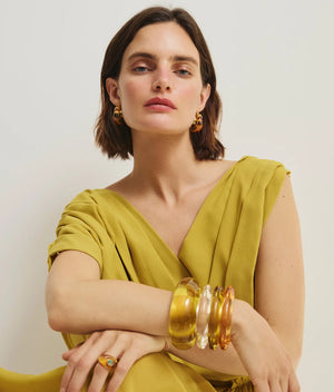 Close-up of the Arc Cuff in Apple by Lizzie Fortunato, featuring a snug fit and unique domed shape.