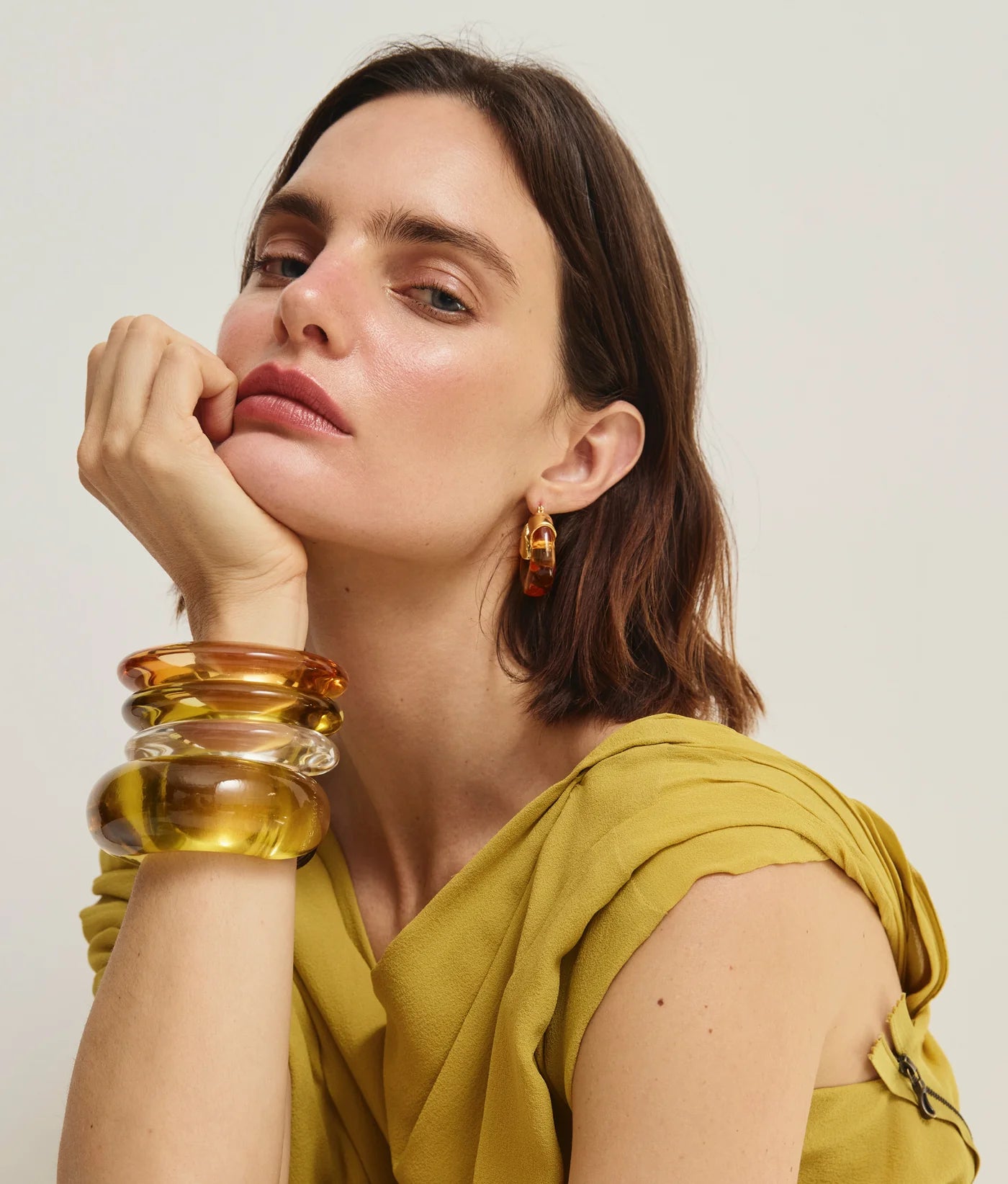 Elegant display of the Arc Cuff in Apple, a signature piece by Lizzie Fortunato, perfect for stacking.