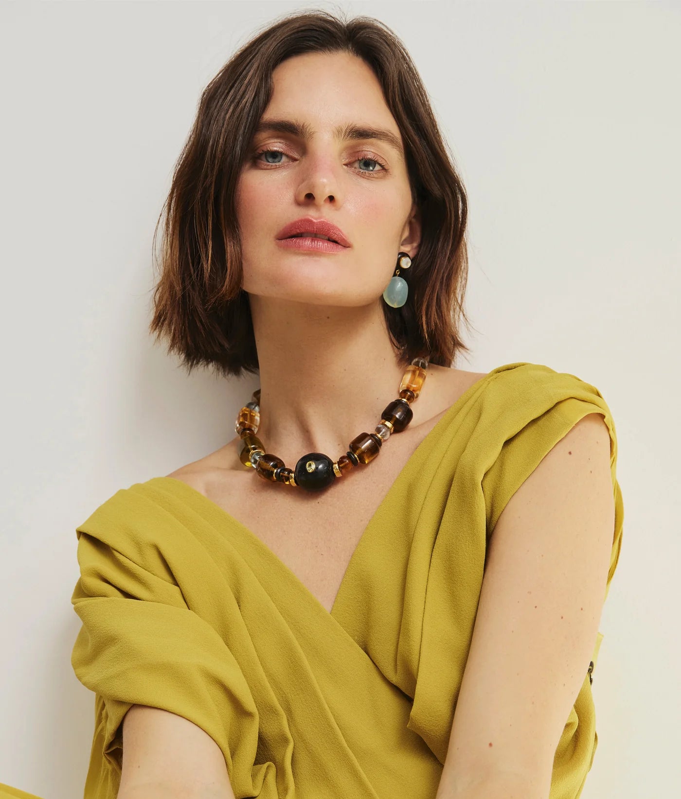 Close-up view of the Laurel Earrings in Multi by Lizzie Fortunato, showcasing intricate details of the gold-plated brass, wood, and colorful aqua chalcedony.
