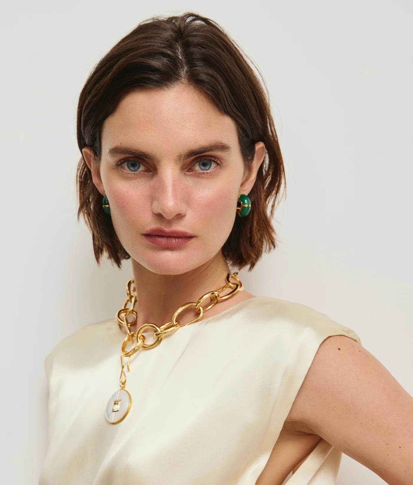 Close-up of Zellige Hoops in Green Jade featuring African jade stone inlay and gold-plated brass.
