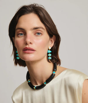 Close-up of the Cathedral Collar in Black by Lizzie Fortunato featuring detailed craftsmanship with horn, turquoise, and gold-plated brass.