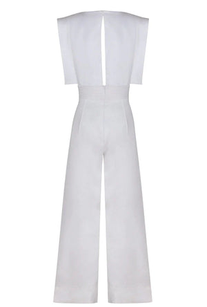 Model wearing Lienzo Abierto jumpsuit in Off White by Andres Otalora, highlighting its chic and comfortable fit.