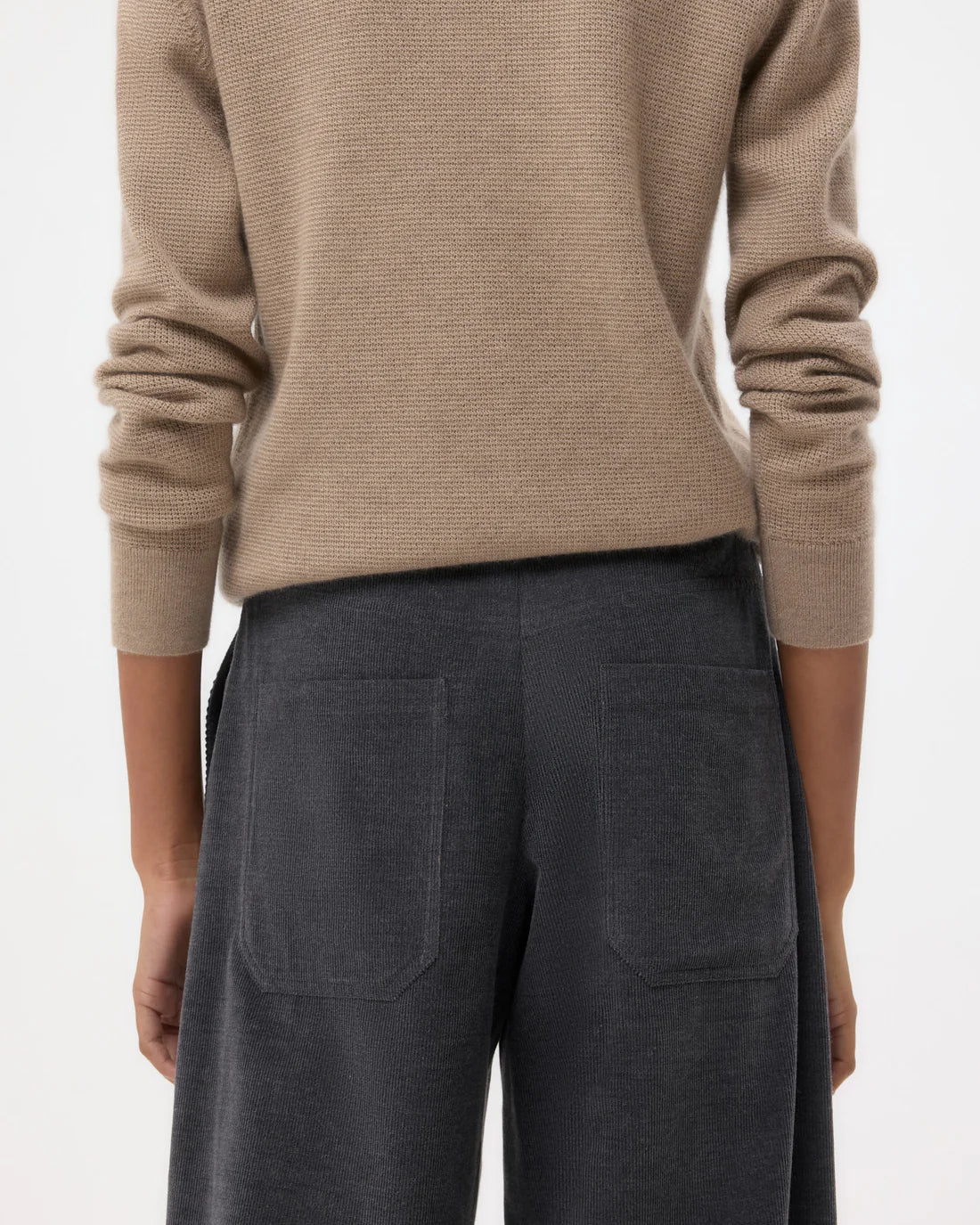 Full view of the Dylan Corduroy Pant in Charcoal Heather Grey displayed on a hanger.