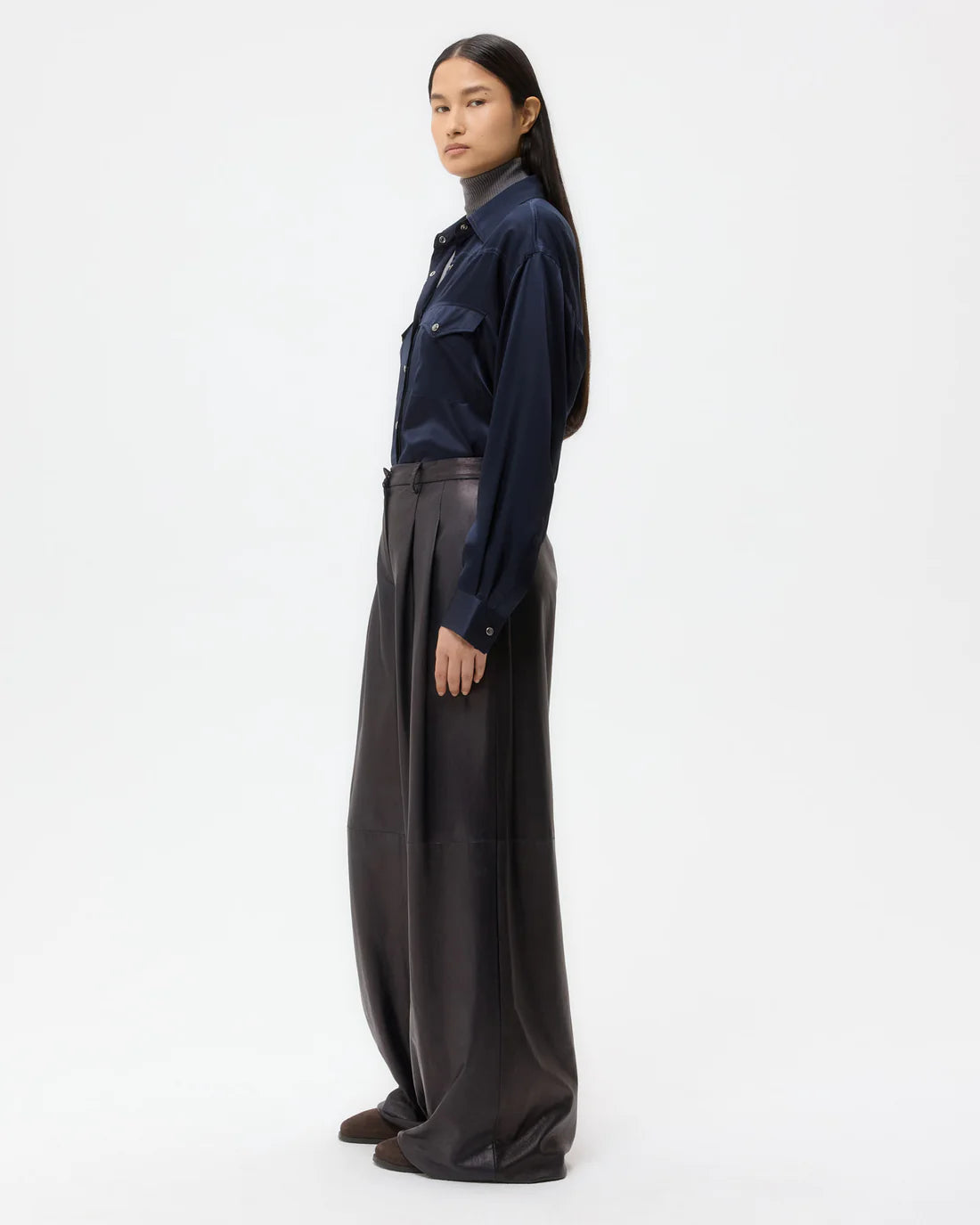 Model wearing the Avery Leather Pant in Dark Midnight, demonstrating its stylish wide leg silhouette.