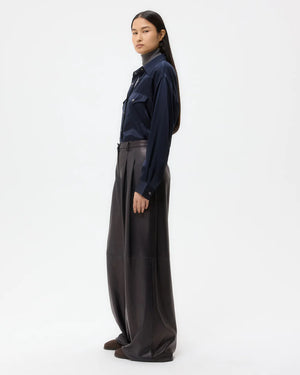 Model wearing the Avery Leather Pant in Dark Midnight, demonstrating its stylish wide leg silhouette.