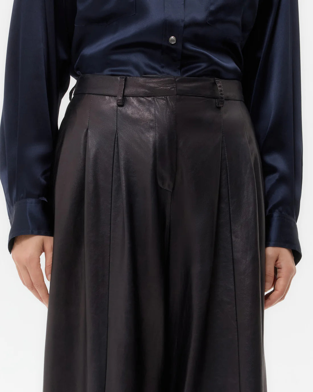 Flat lay of Avery Leather Pant in Dark Midnight, emphasizing its premium leather composition and elegant design.