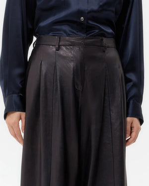 Flat lay of Avery Leather Pant in Dark Midnight, emphasizing its premium leather composition and elegant design.