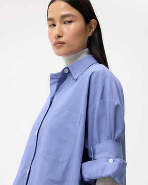TWP Next Ex in White/Navy displayed on a hanger, emphasizing the spread collar and cotton poplin fabric.