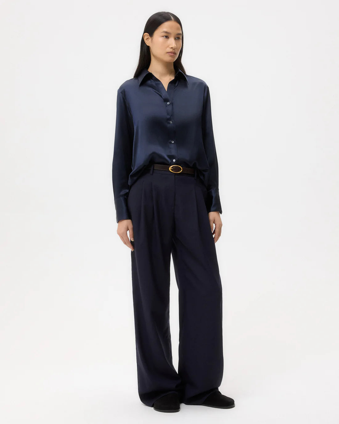 Back view of the Joey Shirt in Midnight featuring the inverted box pleat and raw shirttail hem designed by TWP.
