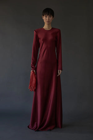 Close-up of Ruth Dress in Burgundy, featuring lightweight shoulder pads and bias cut for added comfort and style by Heirlome.