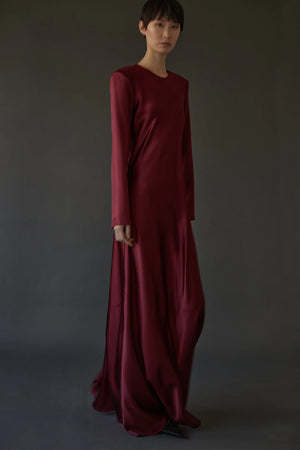 Ruth Dress in Burgundy, showcasing the sleek bias cut and elegant long sleeves, designed by Heirlome.