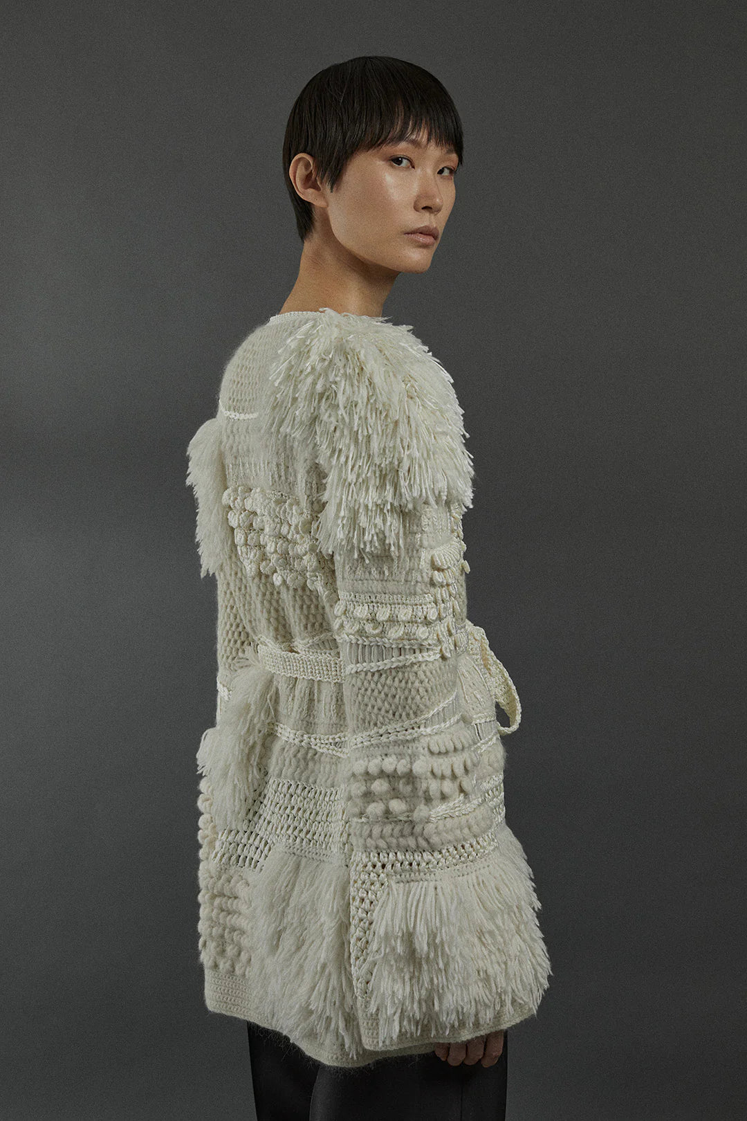 Heirlome Vida Cardigan in Cream draped beautifully, perfect for layering in a stylish outfit.