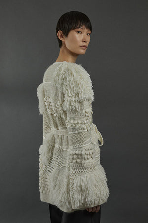 Heirlome Vida Cardigan in Cream draped beautifully, perfect for layering in a stylish outfit.