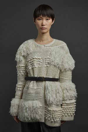 Close-up of the Heirlome Vida Cardigan in Cream, highlighting the intricate hand-crafted stitches.