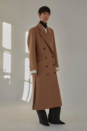 Close-up of the Lilli Coat in Camel highlighting the luxurious Italian camel hair fabric.