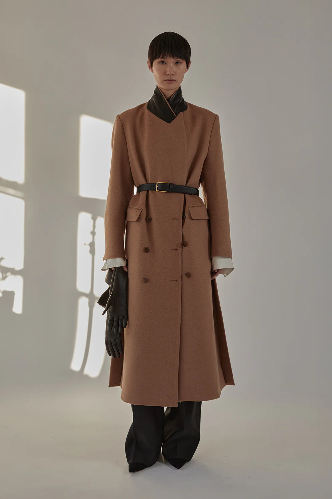 Flap pockets detail on the Lilli Coat in Camel showcasing premium craftsmanship.
