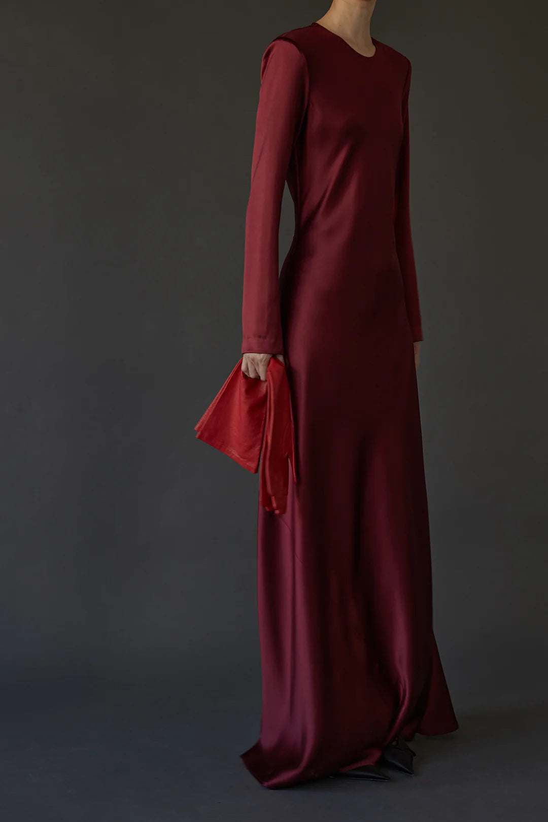 Ruth Dress in Burgundy flat lay, emphasizing the luxurious silk satin fabric and sophisticated design details.
