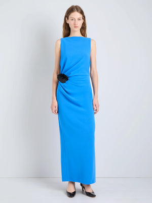 Close-up of the Indria Dress in New Blue, featuring rich fabric details and the handmade Italian leather flower accent.