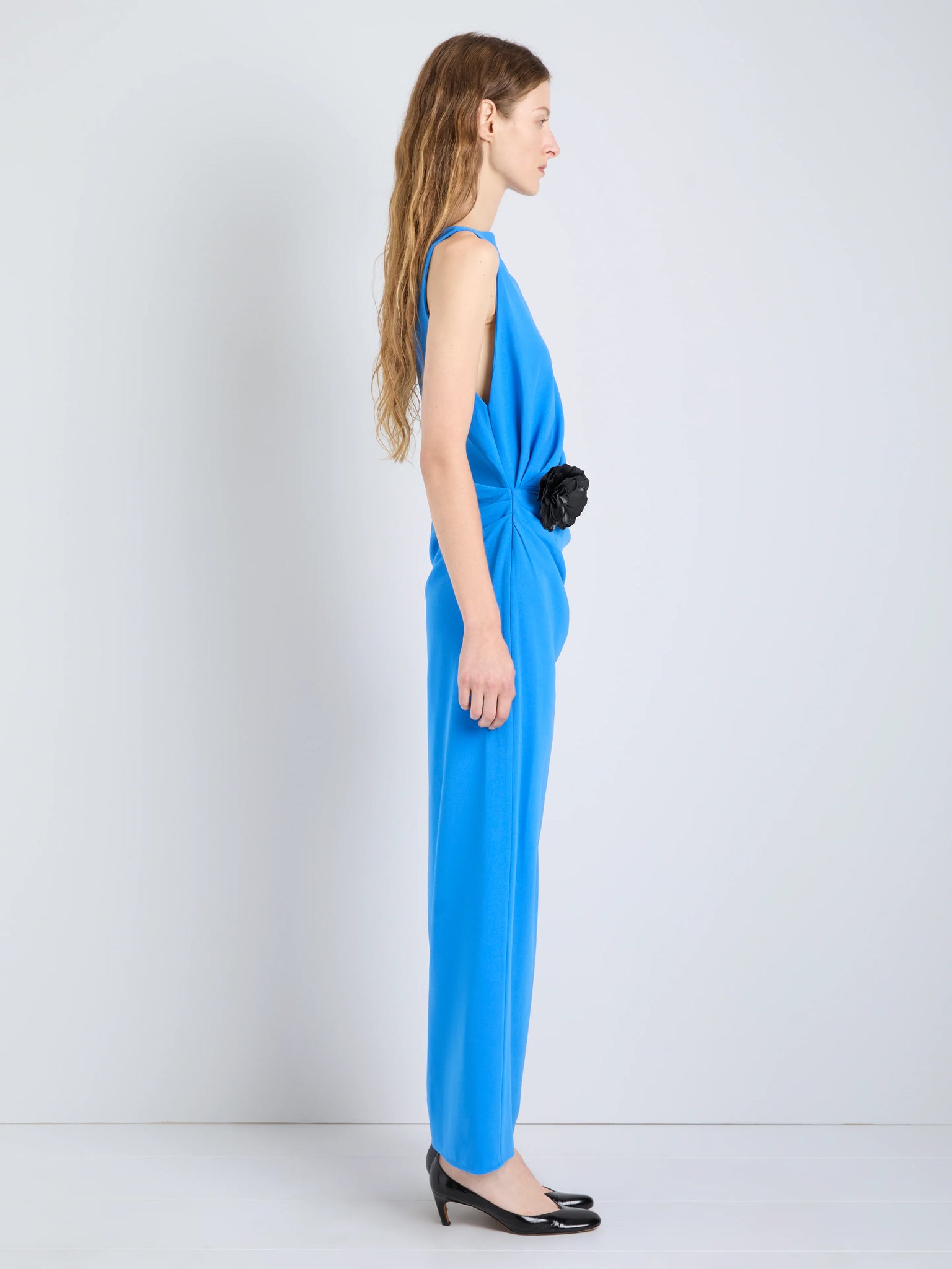Full view of the Indria Dress in New Blue, highlighting its modern silhouette and unique design elements.