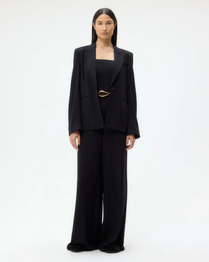 Back view of the Boy Blazer in Midnight emphasizing the back vent and overall elegant silhouette.