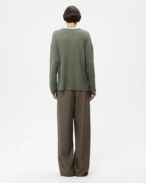 Model wearing Sulli Pant in Medium Heather Grey Multi styled with a top, showcasing the chic and versatile look.