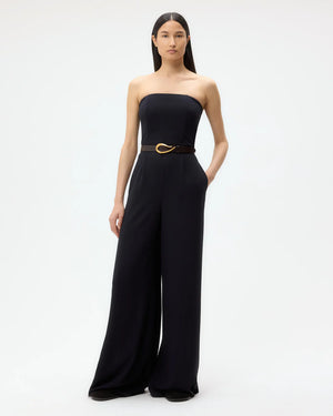 Close-up of the fitted bust detail of the Jade Jumpsuit in Midnight, showcasing the elegant drapey wool crepe fabric.