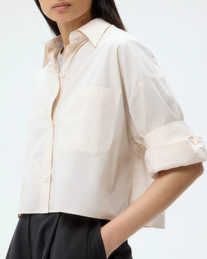 Model showcasing the Next Ex Shirt in Pink Tint, perfect for a casual yet chic summer outfit.