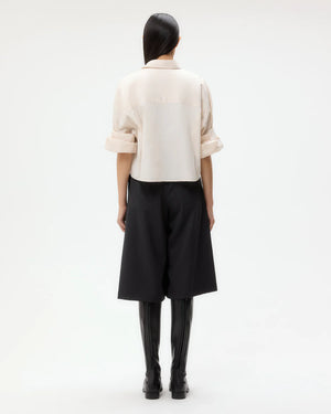 Back view of the Next Ex Shirt in Pink Tint, illustrating the cropped cut and stylish fit.
