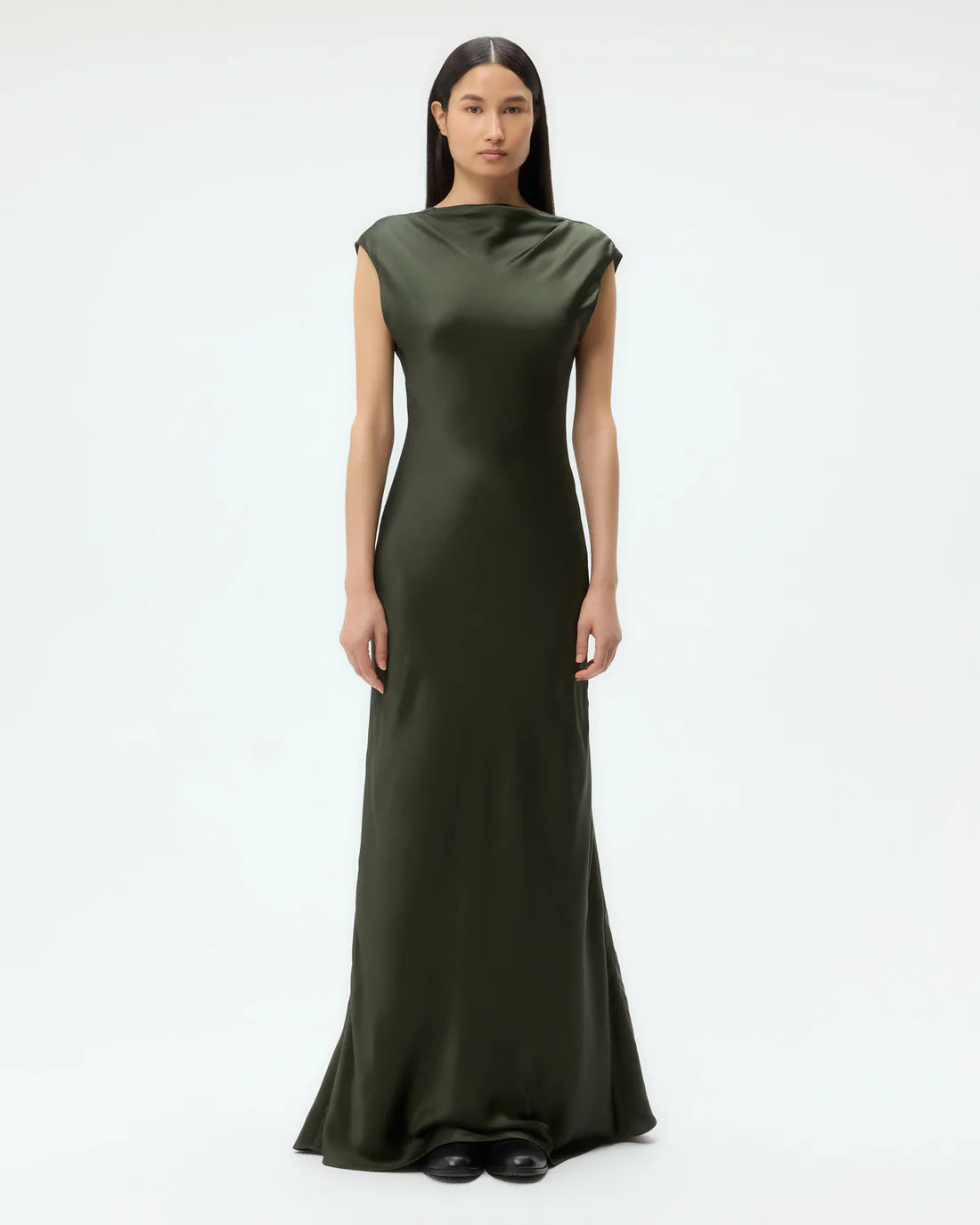 Back to You Dress in Duffle Bag displayed with its fitted silhouette and low cut back for a chic look.