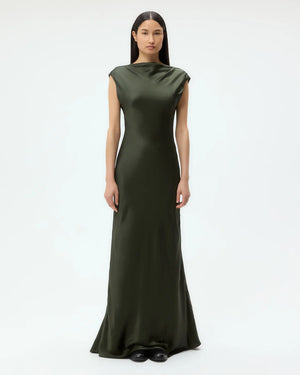 Back to You Dress in Duffle Bag displayed with its fitted silhouette and low cut back for a chic look.