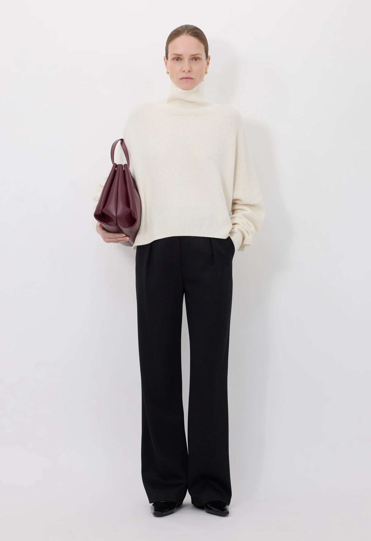 Close-up of the Luke Stand Collar Sweater in Ivory, highlighting the soft wool and cashmere blend texture.