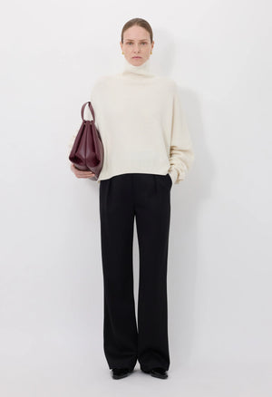 Close-up of the Luke Stand Collar Sweater in Ivory, highlighting the soft wool and cashmere blend texture.