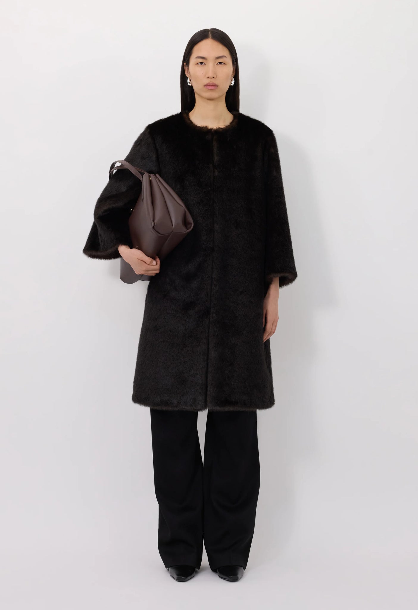 Moore Faux Fur Coat in Grizzly, highlighting the hidden button placket and stylish 3/4 sleeves.