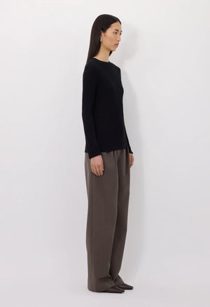 Ortigia LDS Ribbed Long Sleeve T-shirt in Black laid flat to emphasize its sleek design and tailored fit.