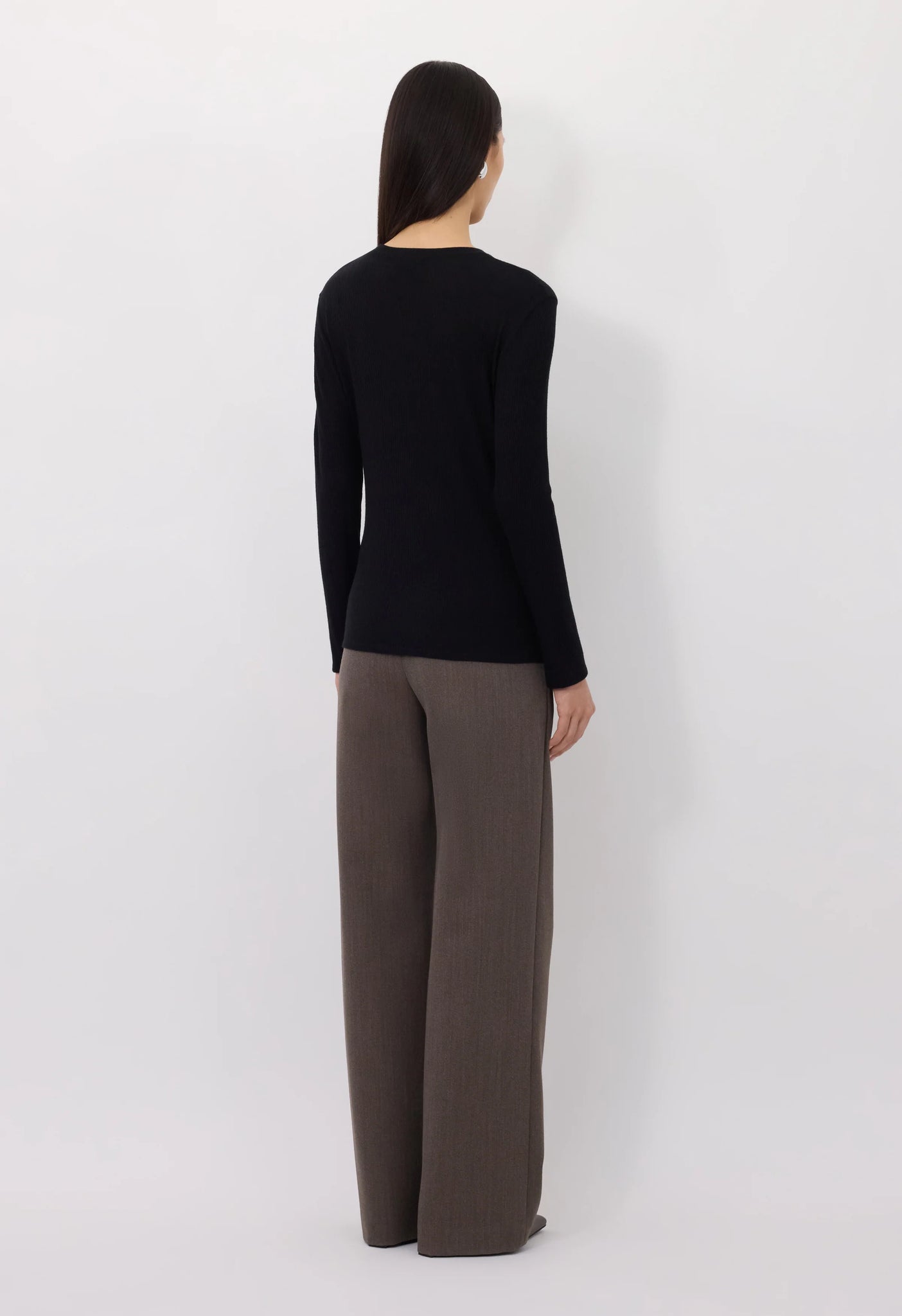 Ortigia LDS Ribbed Long Sleeve T-shirt in Black worn casually with jeans for a stylish everyday look.