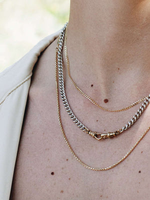Model wearing the Vintage Clip Chain in Silver showcasing its versatility as a stylish necklace and charm holder.