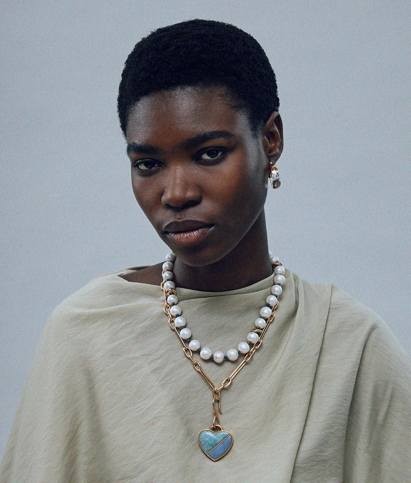 Mini Organic Hoops in Clear styled with casual wear, perfect for any occasion by Lizzie Fortunato.