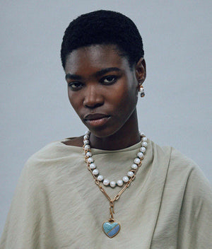 Mini Organic Hoops in Clear styled with casual wear, perfect for any occasion by Lizzie Fortunato.