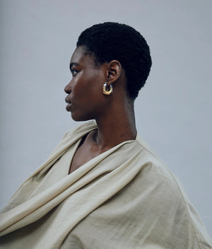 Elegant gold and silver-plated brass Mini Organic Hoops in Mixed Metal, perfect for versatile styling.