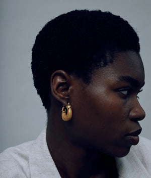 Close-up of Mini Organic Hoops in Mocha, showcasing the beautiful gold plating and rich color of the resin.