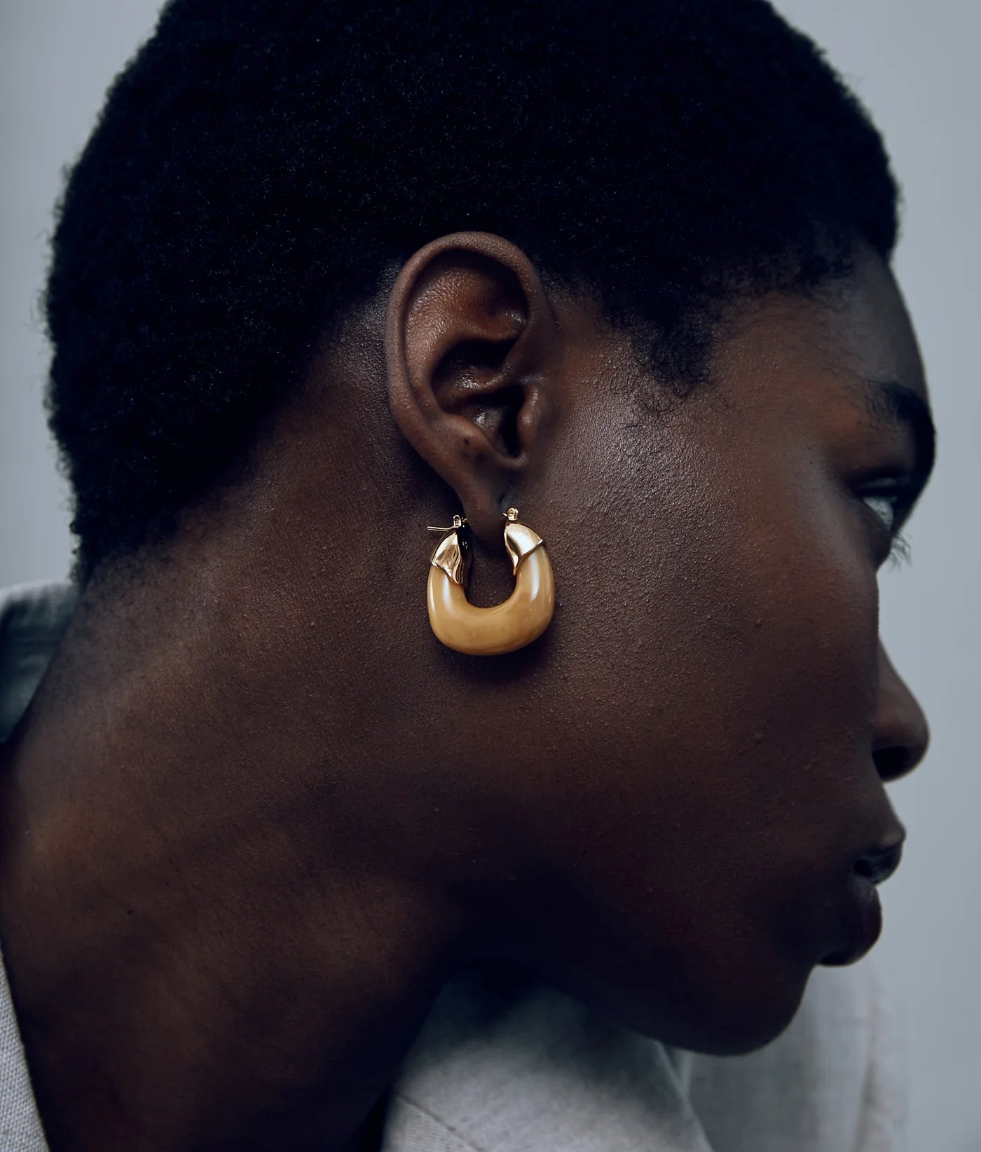 Model wearing Mini Organic Hoops in Mocha by Lizzie Fortunato, highlighting their versatile style and perfect drop length.