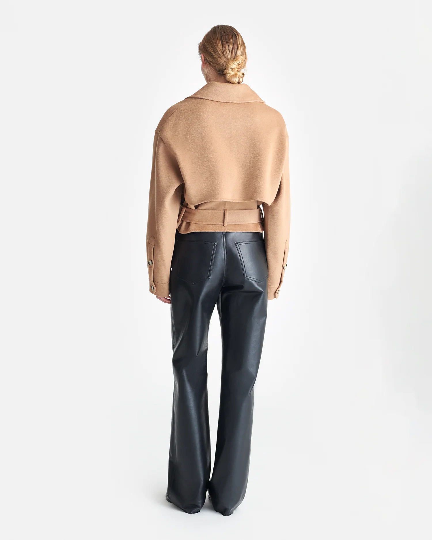 Side view of the Nanushka Satoyo Jacket in Camel, featuring storm flaps and a stylish design.