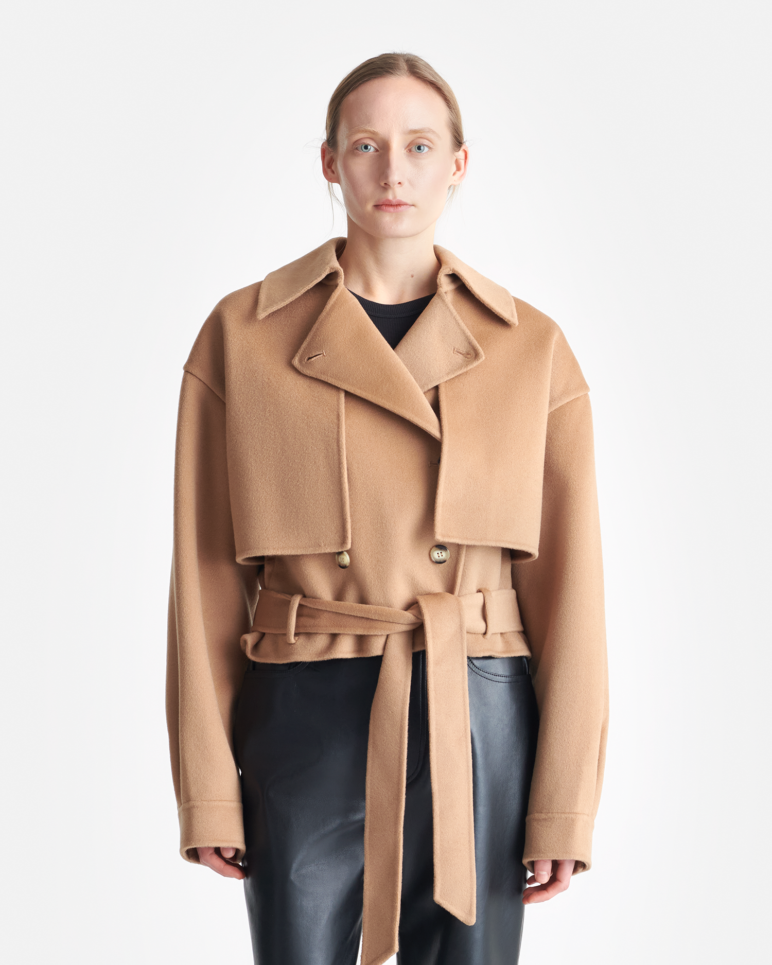 Back view of the Nanushka Satoyo Jacket in Camel, highlighting the elegant and warm silhouette.