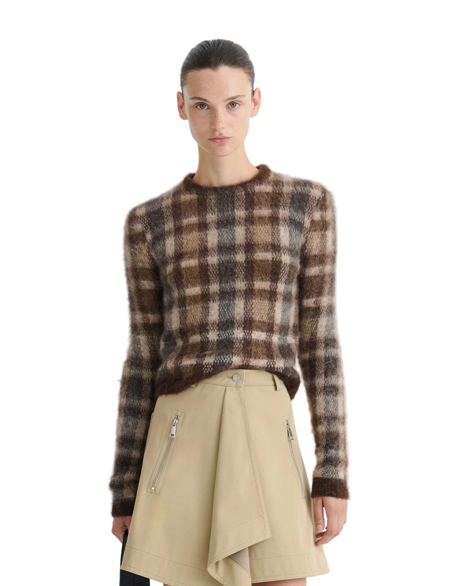 Farica Sweater in Brown/Creme Check by Nanushka displayed on a hanger, emphasizing its cropped silhouette.