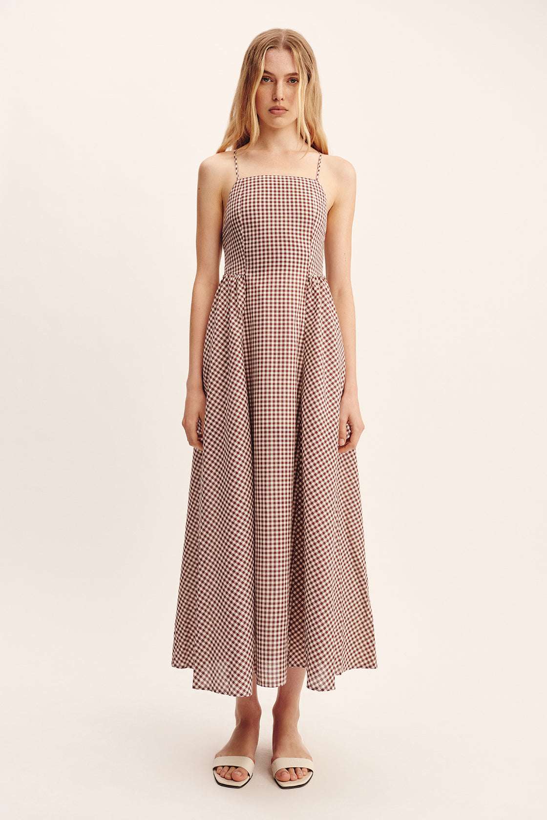 Detailed view of Callie Dress in Petite Mocha Gingham showcasing its hand-loomed cotton fabric.