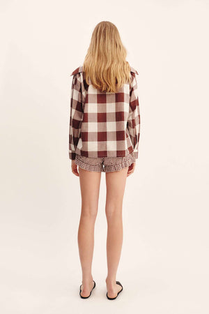 Model wearing the Callie Shirt in Mocha Gingham, paired stylishly with Callie Shorts.