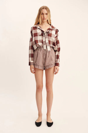 Back view of Callie Shirt in Mocha Gingham, showcasing hand-loomed cotton fabric and center-front buttons.