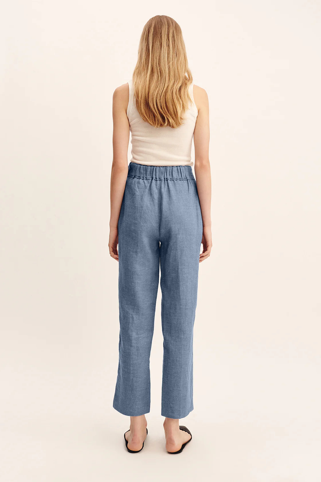 Back view of Thea Trousers in Steel Blue, demonstrating the elegant fit and tailored design.