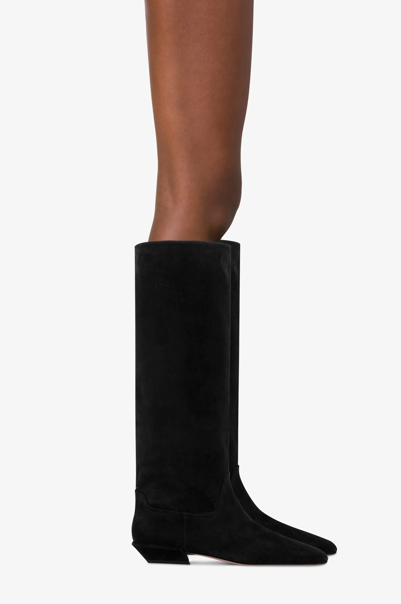 Bettina Boot in Black Suede styled with chic outfits, demonstrating its versatility and modern appeal.