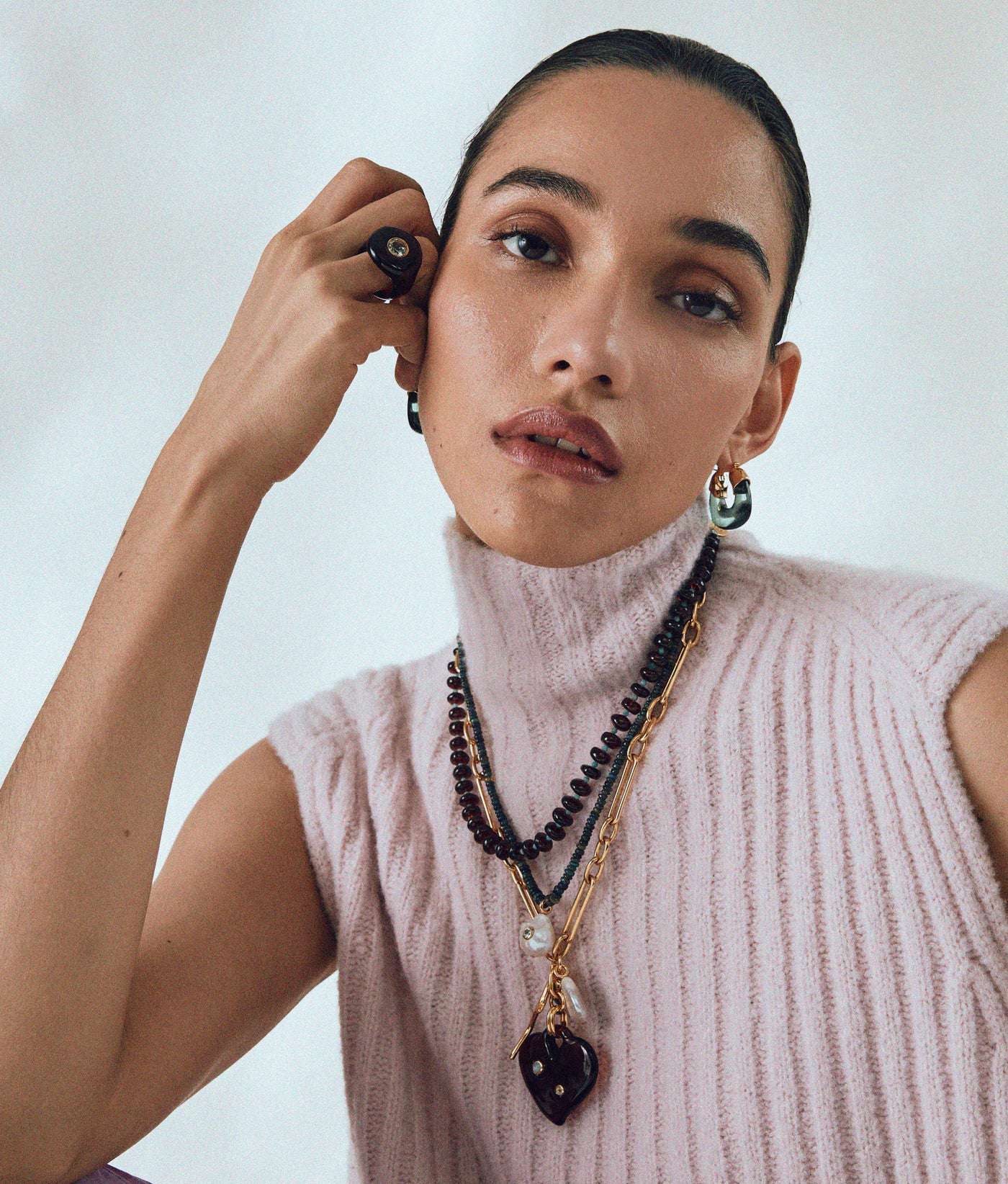 Mini Organic Hoops in Forest displayed on a light background, emphasizing their unique shape and earthy color, ideal for an organic jewelry collection.